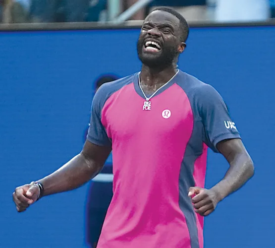 Defending champs reach quarters at U.S. Open